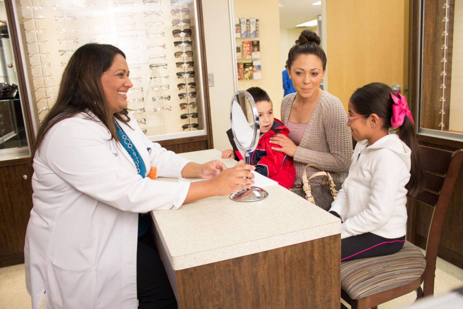 Child patient viewing new glasses