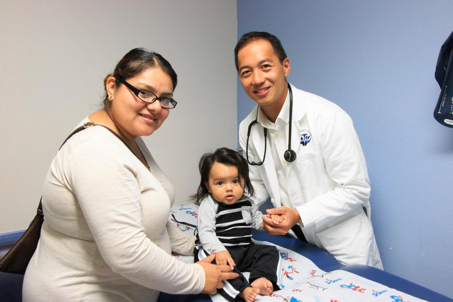 Doctor with a patient and their baby