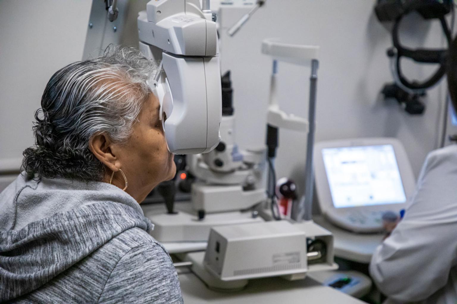 Elderly patient having their eyes examined